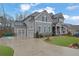 Beautiful two-story home with an attached garage and meticulously landscaped front yard at 430 Parkbrook Way, Canton, GA 30114