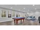 Large game room with a billiards table, comfortable seating, and bright natural light at 430 Parkbrook Way, Canton, GA 30114