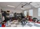 Spacious garage with black and grey checkered flooring, ample storage, and well-lit workspace at 430 Parkbrook Way, Canton, GA 30114