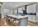 Large kitchen island with bar stool seating and white countertops; ideal for casual dining at 430 Parkbrook Way, Canton, GA 30114