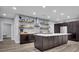 Spacious kitchen boasts a large center island, wood cabinets, and modern stainless appliances at 430 Parkbrook Way, Canton, GA 30114