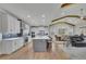 Open-concept kitchen with white cabinets, a large island, and stainless steel appliances at 430 Parkbrook Way, Canton, GA 30114