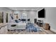 Inviting living room with a sectional sofa, large TV, and access to the outdoors at 430 Parkbrook Way, Canton, GA 30114