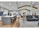 Open living room with view of kitchen and dining room, seamlessly connected for modern living at 430 Parkbrook Way, Canton, GA 30114