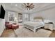 Tranquil main bedroom with a comfy chair and ottoman, a fan, and ample natural light at 430 Parkbrook Way, Canton, GA 30114