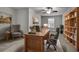 Comfortable home office with desk, chairs, bookshelf, and natural light at 430 Parkbrook Way, Canton, GA 30114