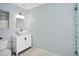 Charming bathroom featuring a vessel sink, decorative mirror, and blue tiled shower at 1002 Defoors Nw Lndg, Atlanta, GA 30318