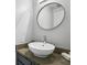 Bathroom featuring a modern vessel sink, gray cabinets and a round mirror at 1002 Defoors Nw Lndg, Atlanta, GA 30318