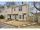 Charming townhome with well-maintained lawn and inviting entrance in a desirable neighborhood at 1002 Defoors Nw Lndg, Atlanta, GA 30318