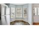 Kitchen nook boasts natural light and slate flooring with view to the front exterior at 1002 Defoors Nw Lndg, Atlanta, GA 30318