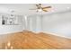Open-concept living space featuring hardwood flooring, neutral walls, and access to other living areas at 1002 Defoors Nw Lndg, Atlanta, GA 30318