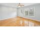 Living room featuring hardwood flooring and natural light, with a door leading to the exterior at 1002 Defoors Nw Lndg, Atlanta, GA 30318