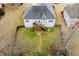 Aerial view of private fenced backyard, with deck, patio, and mature landscaping at 2657 Neighborhood S Walk, Villa Rica, GA 30180