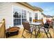 Outdoor deck featuring an outdoor dining table and a fire pit at 2657 Neighborhood S Walk, Villa Rica, GA 30180