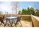 Outdoor deck featuring an outdoor dining table and tree line view at 2657 Neighborhood S Walk, Villa Rica, GA 30180