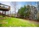 Well-manicured backyard, complemented by lush green lawn and a sturdy fence at 2657 Neighborhood S Walk, Villa Rica, GA 30180