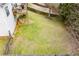 Aerial view showcases a large backyard area with wooden fence and access to wooden deck at 2657 Neighborhood S Walk, Villa Rica, GA 30180