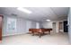Finished basement with a billiard table, neutral carpet and lighting at 2657 Neighborhood S Walk, Villa Rica, GA 30180