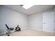 Finished basement provides versatile space for a home gym with exercise bike on neutral carpet against freshly painted walls at 2657 Neighborhood S Walk, Villa Rica, GA 30180