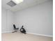 Basement with neutral carpet perfect for home gym featuring stationary exercise bicycle against freshly painted walls at 2657 Neighborhood S Walk, Villa Rica, GA 30180
