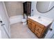 Bathroom with tiled floors, features a vanity with drawers, toilet, and a combined tub and shower for comfort and convenience at 2657 Neighborhood S Walk, Villa Rica, GA 30180