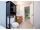 Well-lit bathroom with dark wood storage, featuring neutral walls and tile floors providing a clean and functional space at 2657 Neighborhood S Walk, Villa Rica, GA 30180