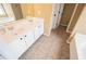 Bathroom featuring double sinks and a bathtub at 2657 Neighborhood S Walk, Villa Rica, GA 30180