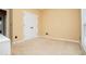 Neutral carpeted bedroom with a double door closet and natural light from the window at 2657 Neighborhood S Walk, Villa Rica, GA 30180