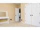 Comfortable bedroom featuring neutral paint, plush carpeting, and a functional vanity area at 2657 Neighborhood S Walk, Villa Rica, GA 30180