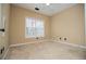 Cozy bedroom featuring a window and neutral carpeting at 2657 Neighborhood S Walk, Villa Rica, GA 30180