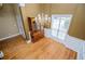Elegant dining area with hardwood floors, decorative chandelier and built-in china cabinet at 2657 Neighborhood S Walk, Villa Rica, GA 30180