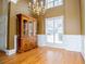 Dining room features hardwood floors, elegant lighting fixture and built-in cabinet at 2657 Neighborhood S Walk, Villa Rica, GA 30180