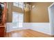 Spacious dining room featuring hardwood floors and elegant chandelier at 2657 Neighborhood S Walk, Villa Rica, GA 30180
