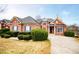 Well-maintained brick home boasts lush landscaping and a private driveway at 2657 Neighborhood S Walk, Villa Rica, GA 30180
