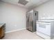 Modern kitchen featuring stainless steel appliances and neutral cabinets at 2657 Neighborhood S Walk, Villa Rica, GA 30180