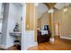 Open-concept living room featuring a vaulted ceiling, hardwood floors, and stylish architectural details at 2657 Neighborhood S Walk, Villa Rica, GA 30180