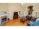 Bright living room with fireplace, vaulted ceiling, hardwood floors and comfortable furnishings at 2657 Neighborhood S Walk, Villa Rica, GA 30180