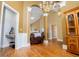 View of a home's living room with hardwood floors, tall ceilings, and elegant dining area at 2657 Neighborhood S Walk, Villa Rica, GA 30180