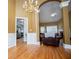 Open-concept living room flows into a kitchen and adjacent dining area with hardwood floors at 2657 Neighborhood S Walk, Villa Rica, GA 30180