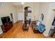 View of a spacious living room with hardwood floors, high ceilings, and comfortable seating at 2657 Neighborhood S Walk, Villa Rica, GA 30180