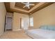Main bedroom with a tray ceiling, fan, and access to an ensuite bathroom at 2657 Neighborhood S Walk, Villa Rica, GA 30180
