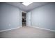 Spacious bonus room with neutral walls and plush carpeting providing a versatile space for relaxing and entertaining at 2657 Neighborhood S Walk, Villa Rica, GA 30180