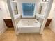 Luxurious bathroom featuring a large soaking tub and and vanities at 6503 Foggy Oak Dr, Fairburn, GA 30213