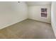 Neutral bedroom with a window for natural light and plush carpeting at 6503 Foggy Oak Dr, Fairburn, GA 30213