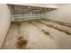 Two car garage with concrete flooring, space to park vehicles and storage at 6503 Foggy Oak Dr, Fairburn, GA 30213