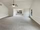 Inviting living room with high ceilings, wainscoting detail, and ample natural light from windows at 6503 Foggy Oak Dr, Fairburn, GA 30213