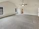 Expansive bedroom featuring vaulted ceilings, a fan, and neutral carpeting at 6503 Foggy Oak Dr, Fairburn, GA 30213