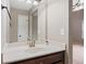 Bathroom sink and vanity featuring a decorative mirror at 825 Bufflehead Ct, Stockbridge, GA 30281