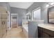 Bathroom with neutral-tone walls, large soaking tub, glass shower, and spacious closet at 825 Bufflehead Ct, Stockbridge, GA 30281