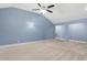 Vaulted ceiling bedroom with carpeting, accent lighting, and bright natural light at 825 Bufflehead Ct, Stockbridge, GA 30281